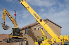 Cat Excavator over Fence